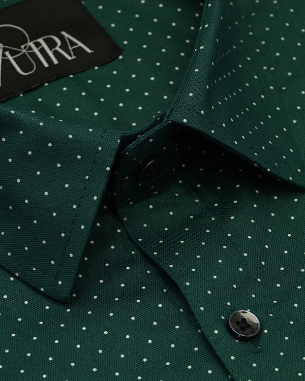 green and white polka dot shirt